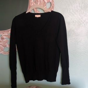 Black v-neck sweater.